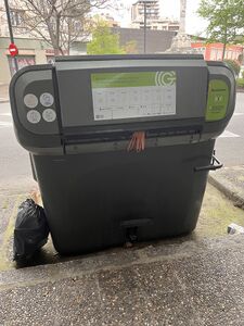 Main bin (grey) for throwing paper, plastic, glass, or general trash, depending on the day of the week